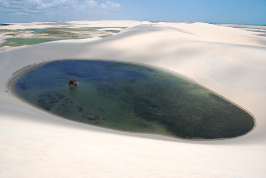 Aerial view of a Lagoon surrounded by white sand dunes, Jericoacoara, Ceara State, Brazil