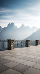 Fototapeta premium Stone terrace with iron railing overlooking majestic mountain peaks in the morning light