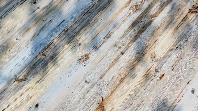 Sunlight filters through trees, casting playful shadows on a weathered wooden deck