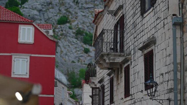 Narrow cobblestone street in a historic Mediterranean old town.