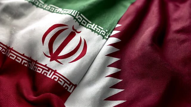 iranian and qatari flag waving together. relations between iran and qatar