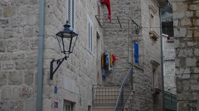 Narrow cobblestone street in a historic Mediterranean old town.