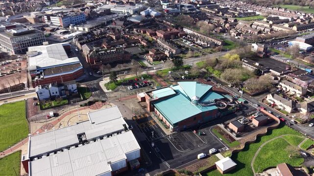 4K drone footage showing Birkenhead town centre with rooftop patterns across the central district.