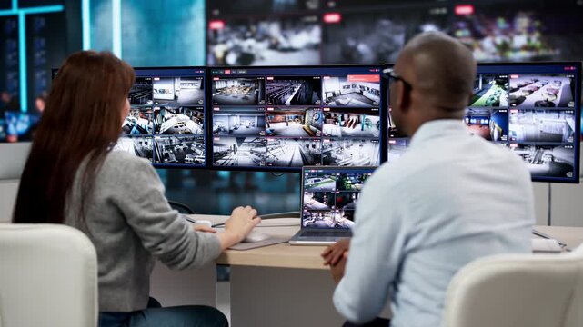 Security Guards Monitoring CCTV Video