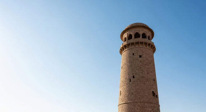 Ancient Stone Tower Against a Brilliant Blue Sky &ndash; Stock Photo