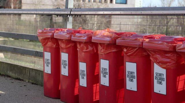 Trash cans for forbidden items, event security discarded items
