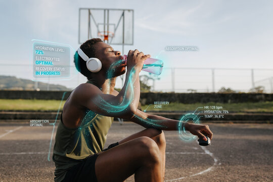 Athlete drinking water during basketball training with biometric hydration and recovery data overlay

Keywords: