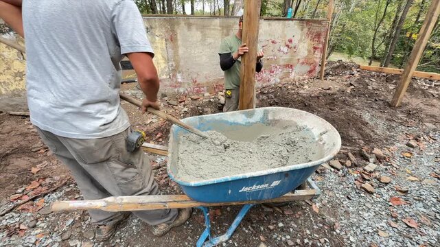 Mixing Cement or concrete in a wheel barrow