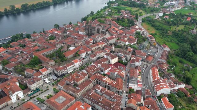  Aerial panoramic view beside the old town of  the city Tui in Spain on a cloudy summer noon.