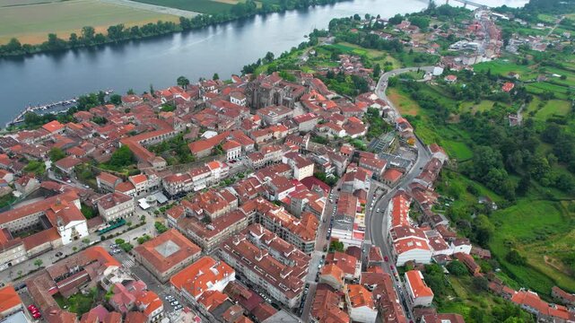  Aerial panoramic view beside the old town of  the city Tui in Spain on a cloudy summer noon.