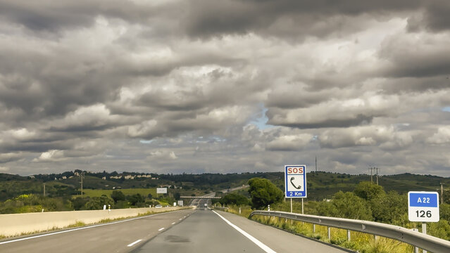 Highway landscape under dramatic clouds near Spanish Portuguese border
