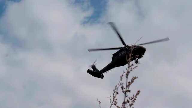 Military helicopter UH-60 Black Hawk seen from ground
