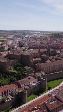 Scenic vertical aerial perspective capturing Mirabel Palace and the old town cityscape of Plasencia.