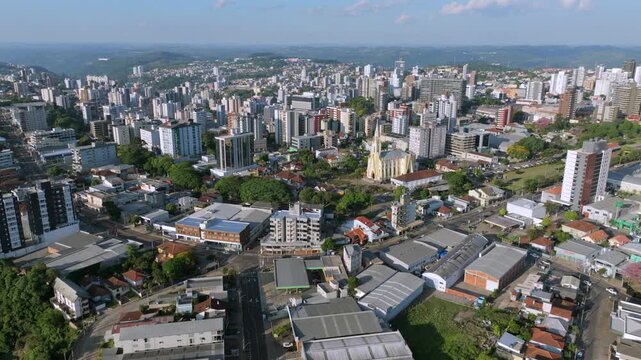 Bento Gon&ccedil;alves skyline and city center in wide aerial establishing view, captured in D-Log with 10-bit color using a Hasselblad sensor.