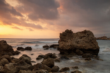 Fototapeta premium Sunset Over Cyprus Coastline with Golden Mediterranean Light