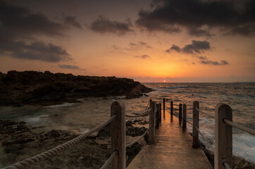 Obraz premium Sunset Over Cyprus Coastline with Golden Mediterranean Light