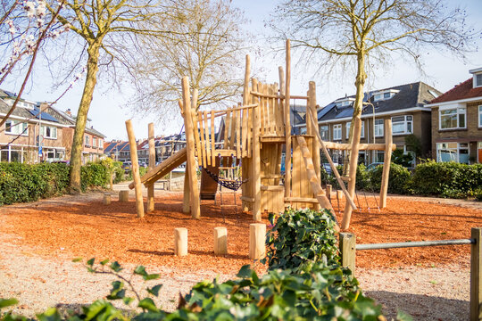 Children's playground with green grass in a residential area in the Netherlands, city of Deventer. High quality photo
