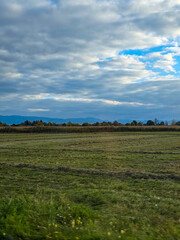 Fototapeta premium Dramatic Autumn Sky over a Mown Field