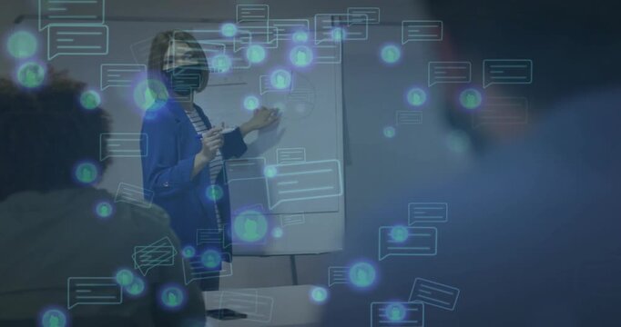 female trainer writing points on flipchart and sparking chat bubbles explaining communication tech