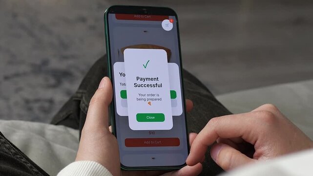 Person making secure credit card payment on smartphone. Seamlessly ordering food through a smartphone. Video captures the click on pay button and instant order confirmation. Ideal for delivery