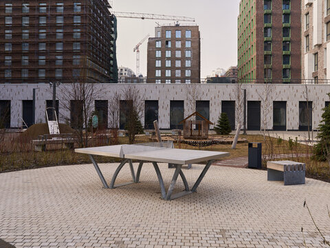 Public table tennis zone designed for residents in landscaped courtyard