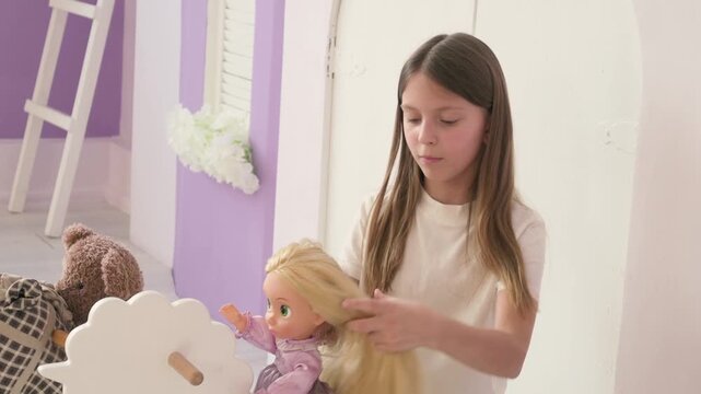 Beautiful Young Girl Styling Her Doll's Long Blonde Hair in a Bright Airy Playroom