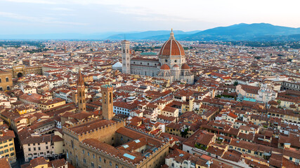 Fototapeta premium Aerial sunrise landscape Florence Italy. Scenic drone shot Duomo cathedral dome historic architecture summer. Renaissance landmark Tuscany travel destination world heritage city nature background.
