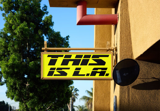 Real photo of  blade hang Sign Outside a Building in LA. PSD mockup.