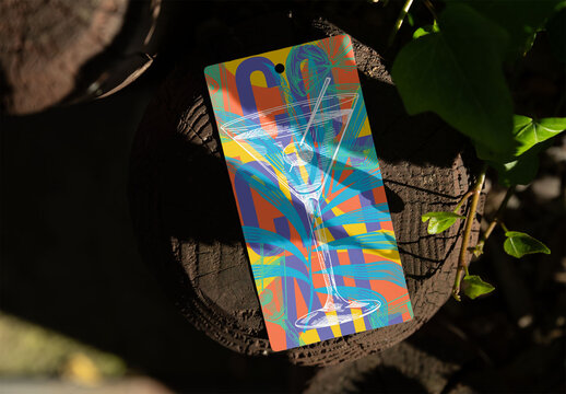 Real photo of Hang Tag Resting on Wood in Sunlight. PSD mockup.