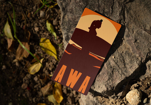 Real photo of Blank Hang Tag on a Rock Surface. PSD mockup.