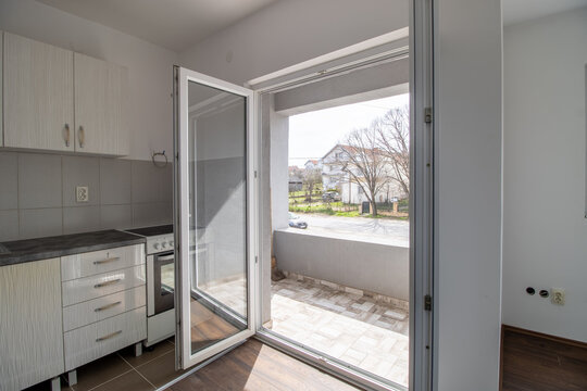 Open balcony door in a small apartment