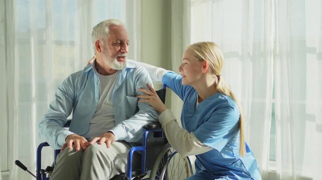 Help support retirement healthcare. Nurse helping old man in wheelchair. Patient and woman in nursing home for medical caregiver. Nurse taking care of paralyzed man in chair for people with disability