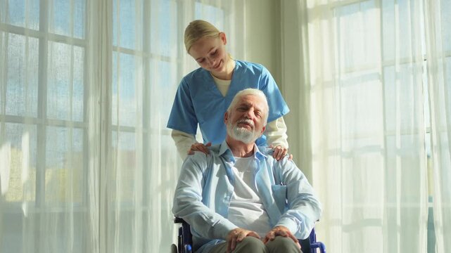 Help support retirement healthcare. Nurse helping old man in wheelchair. Patient and woman in nursing home for medical caregiver. Nurse taking care of paralyzed man in chair for people with disability