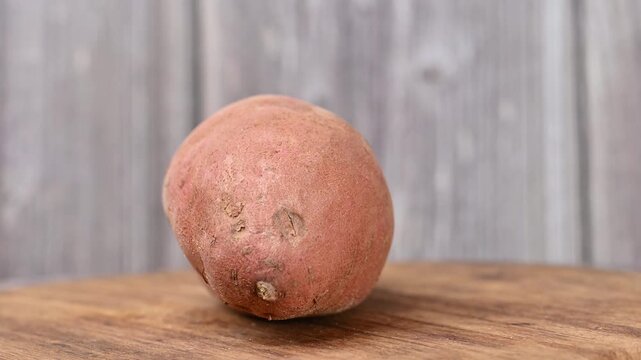 video of a raw sweet potato