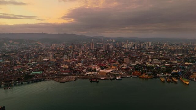 Stunning aerial establishing shot of the Cebu City landscape at nightfall