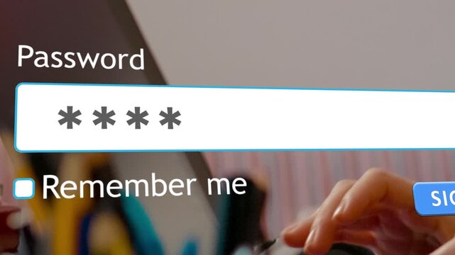 User types password in the login form of a website on a computer screen. Interaction focuses on the password input and submit process.