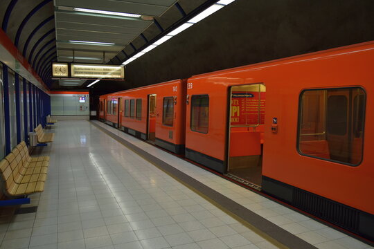 Classic orange HSL (Helsinki Regional Transport) train on a deserted platform at a metro station in Helsinki, Finland, 2015 
