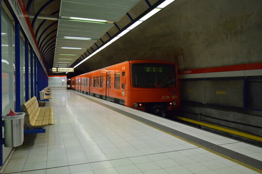 Classic orange HSL (Helsinki Regional Transport) train on a deserted platform at a metro station in Helsinki, Finland, 2015 