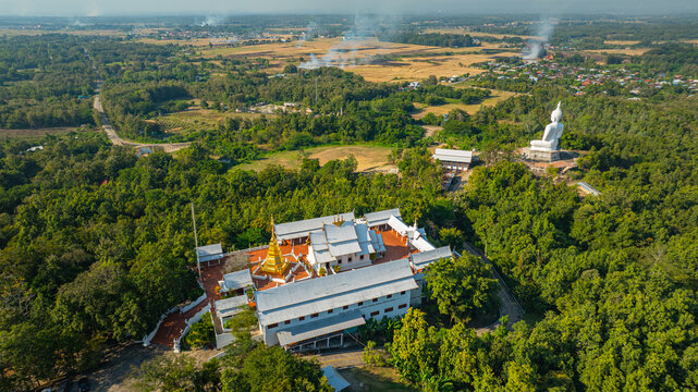 The historic stupa of Wat Phra That Pu Jae in Phrae Province is a centuries old sacred site situated on a mountain. The square chedi enshrines a revered relic of the Buddha and represents