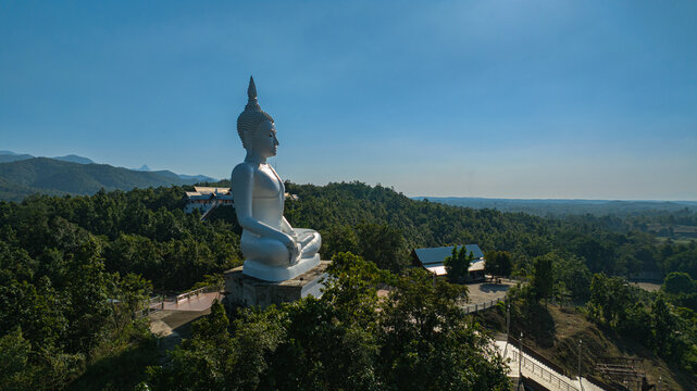 Wat Phra That Pu Jae is a historic mountain temple in Rong Kwang District, Phrae, recognized as a national archaeological site. The ancient square pagoda enshrines a sacred Buddhist relic 