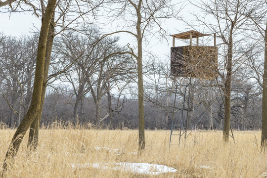 A homemade deer stand in the winter.
