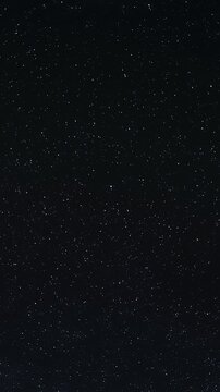 Vertical time-lapse of stars rotating around the north star or Pole star in the night sky
