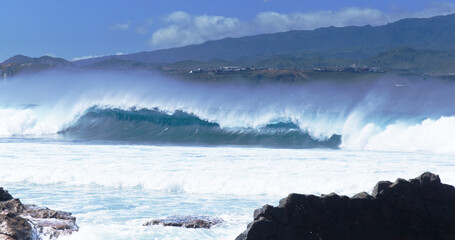 Gran Canaria, view towards Atlantic ocean from El Confital beach on the edge of Las Palmas de Gran Canaria, big waves crushing © Tamara Kulikova