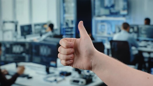 OK hand gesture in modern office workspace