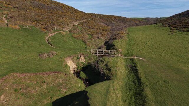 Coastal path drone view above Sandymouth Bay