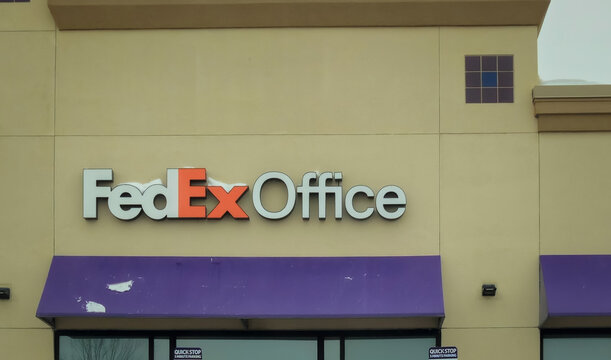 The exterior of a FedEx Office Print & Ship Center on a winter day with snow on the awning (Minnesota, USA - Mar 17, 2026). For Editorial Use Only.