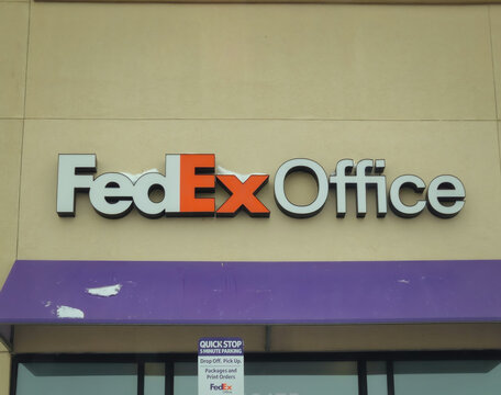 The exterior of a FedEx Office Print & Ship Center on a winter day with snow on the awning (Minnesota, USA - Mar 17, 2026). For Editorial Use Only.