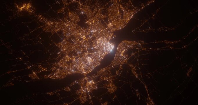 Quebec (Canada) aerial view at night. Top view on modern city with street lights. Camera is zooming out, rotating clockwise