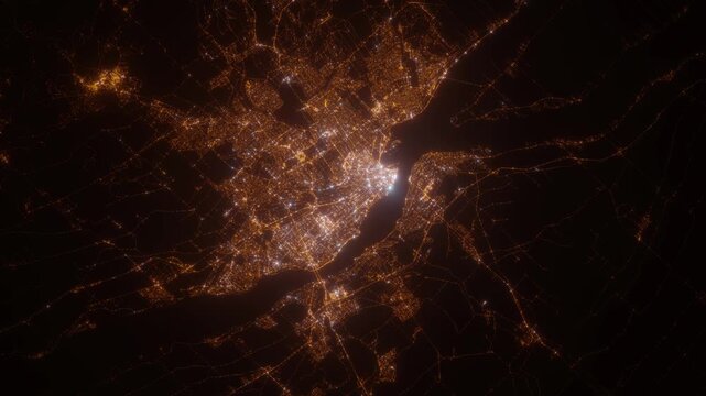 Quebec (Canada) aerial view at night. View on modern city from space. Camera is zooming in, rotating counterclockwise