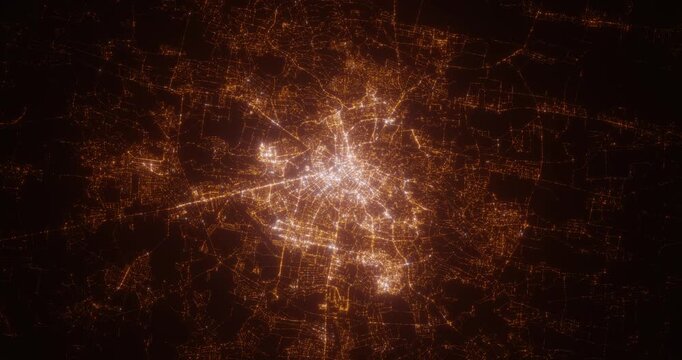 Lviv (Ukraine) aerial view at night. Top view on city from space. Camera is zooming in, rotating clockwise